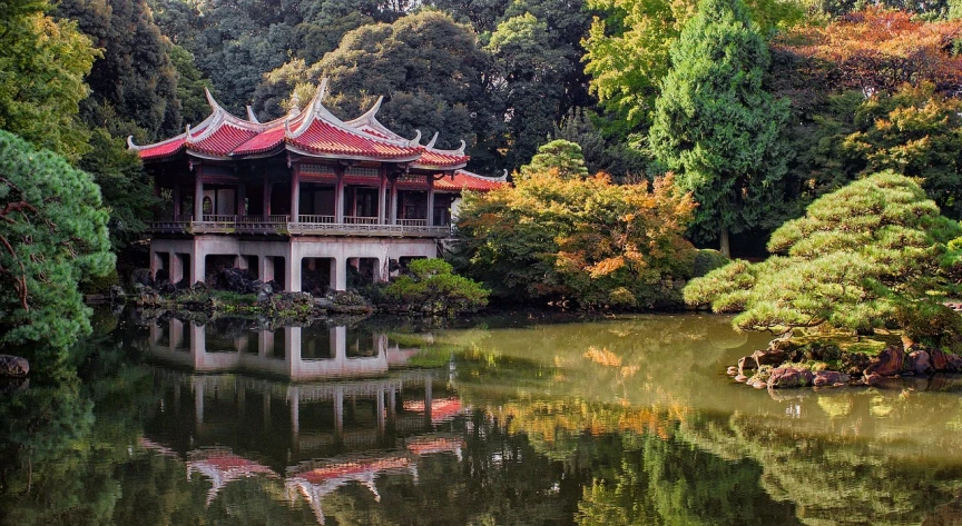 a building in the middle of a pond surrounded by trees, inspired by Itō Jakuchū, flickr, dreamland of chinese, fotografia, happy!!!, october