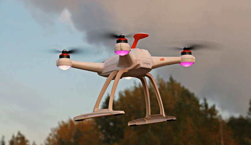 a white drone flying in the sky with trees in the background, a picture, pixabay, figuration libre, flying cars, photorealistic - h 6 4 0, a colorful, 2000s photo