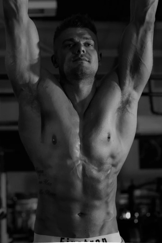 a black and white photo of a man doing pull ups, a portrait, realism, wlop and andrei riabovitchev, focus on torso, half body cropping, armpit