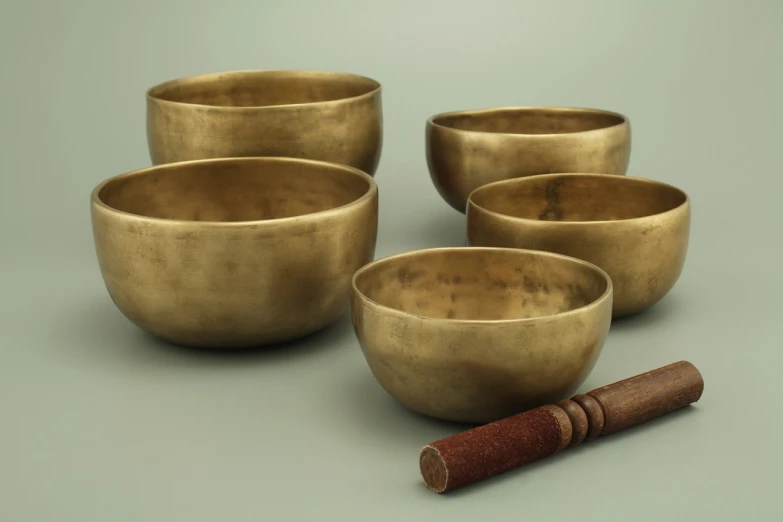 a group of bowls sitting on top of a table, an ambient occlusion render, by Jan Kupecký, buddhist, an instrument, highly detailed product photo, -w 512