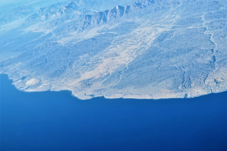an aerial view of a large body of water, a tilt shift photo, by Edward Corbett, hurufiyya, desert and blue sky, mountains and ocean, usa-sep 20, panels