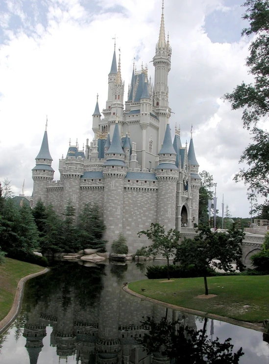 a castle sitting on top of a lush green field, by Walt Disney, flickr, ebay photo, high details!, mirror lake, in 2 0 0 2