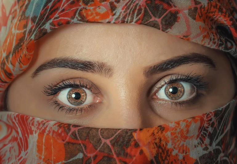 a close up of a person wearing a headscarf, by Maryam Hashemi, trending on pexels, hyperrealism, beautifull lovely eyes, eyes). full body realistic, big bold thick eyebrows, grey contacts