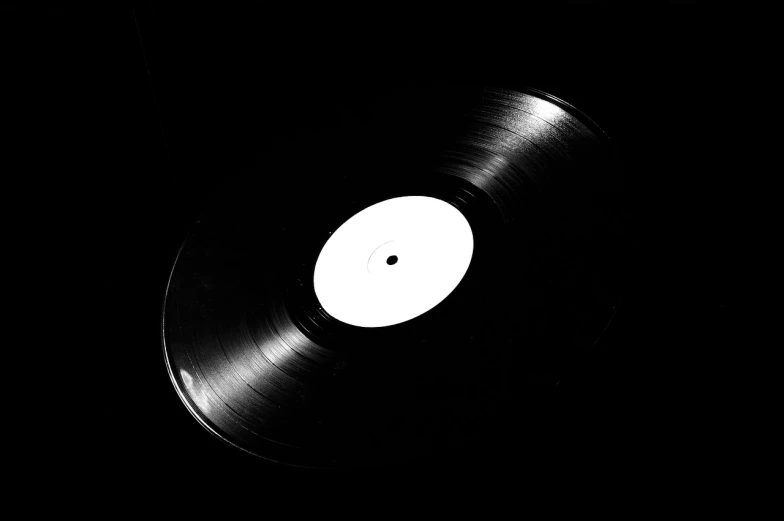 a black and white photo of a vinyl record, by Matthias Stom, detailed studio photograph, high quality photo, close-up product photo