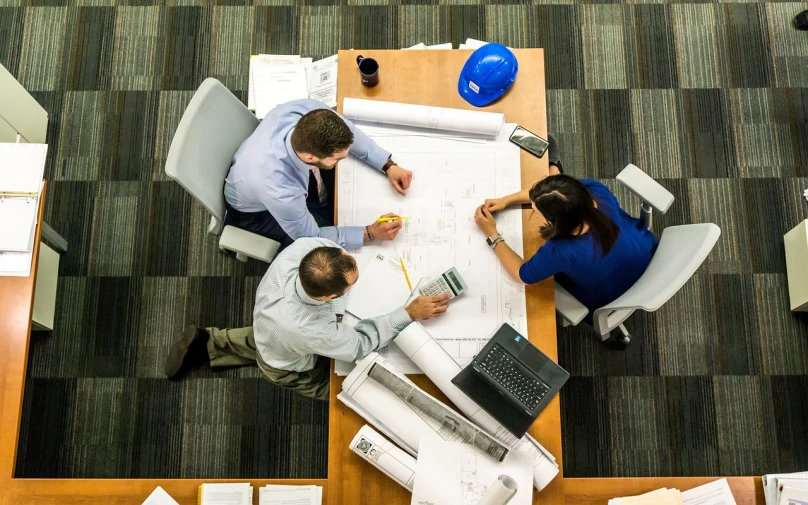 a couple of people that are sitting at a table, by John Murdoch, pexels, architecture technical blueprint, group photo, inspect in inventory image, top - down photo