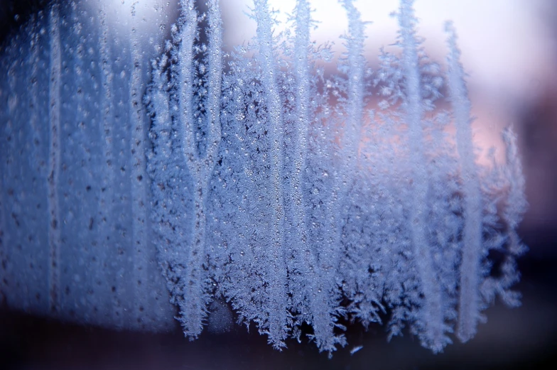 a close up of ice crystals on a window, pexels, istock, cold colour temperature, misty wisps, close up to the screen