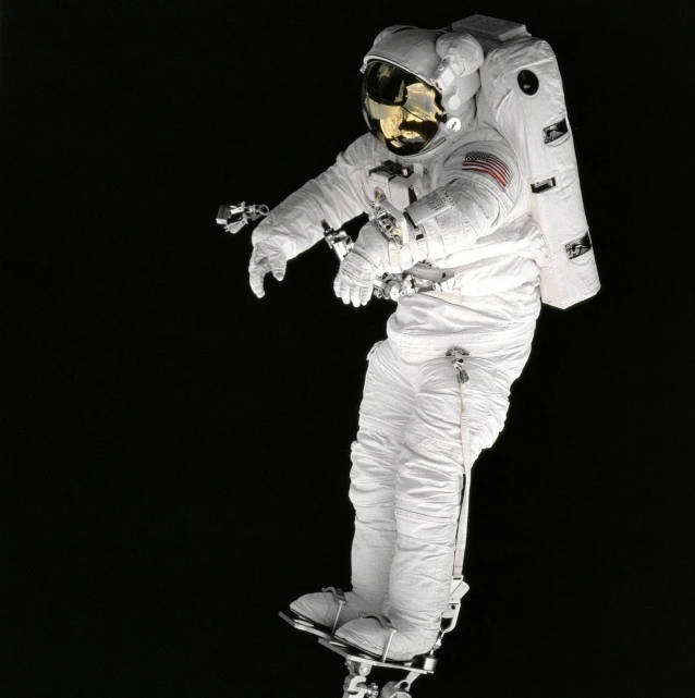 an astronaut flying through the air on a skateboard, by Alan Bean, flickr, standing with a black background, reflective suit, 1998 photo, full body close-up shot