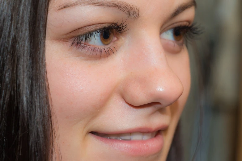 a close up of a person with a cell phone, by Maksimilijan Vanka, shutterstock, photorealism, cute nose, young female face, 3 / 4 view portrait, uhd face details