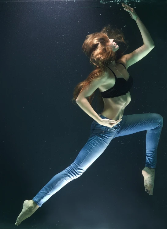 a woman in a bikini swims under water, a portrait, figuration libre, wearing jeans, jump pose, very beautiful photo, backlit