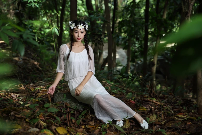 a woman in a white dress sitting in the woods, inspired by Dai Xi, renaissance, 1930s style clothing, li zixin, in the tropical wood, transparent