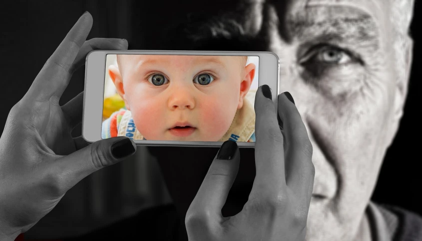 a close up of a person holding a cell phone, a black and white photo, by Giorgio Cavallon, pixabay, surrealism, father with child, photorealistic faces, the look of an elderly person, big brother is watching you