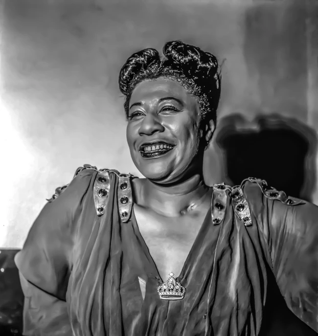 a black and white photo of a woman smiling, a portrait, by Bruce Gilden, pixabay contest winner, harlem renaissance, drag queen, award winning colorized photo, crying queen of feathers, curvaceous. detailed expression