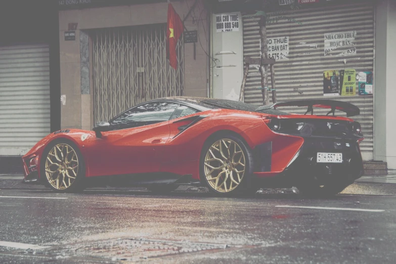 a red sports car parked on the side of the road, a picture, tumblr, wet streets, f12, lotus, banner