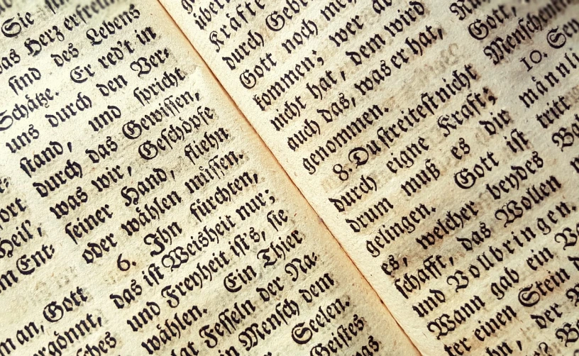 a close up of a book with writing on it, a woodcut, by Jakob Häne, pexels, istockphoto, bible, high detailed close up of, german
