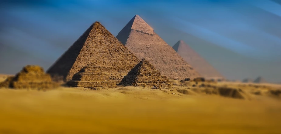 three pyramids in the desert with a blue sky in the background, egyptian art, pexels contest winner, avatar image, papyrus, babel, crypto