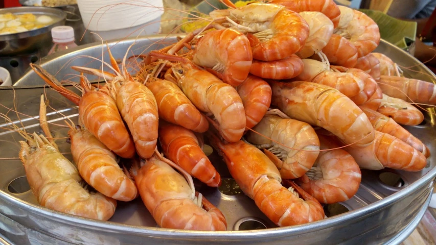 a bunch of shrimp sitting on top of a metal pan, shutterstock, hurufiyya, costa blanca, jewel, harbor, nice face