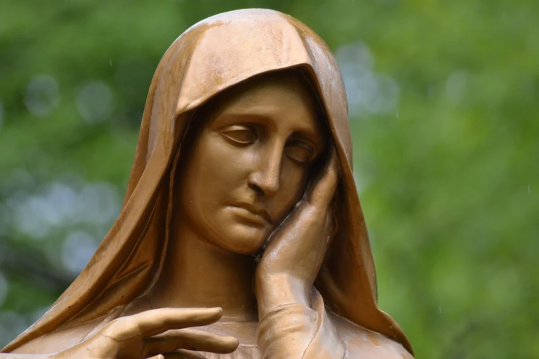 a close up of a statue of a woman, a statue, inspired by Mary Cameron, shutterstock, catholic icon, sad scene, watch photo