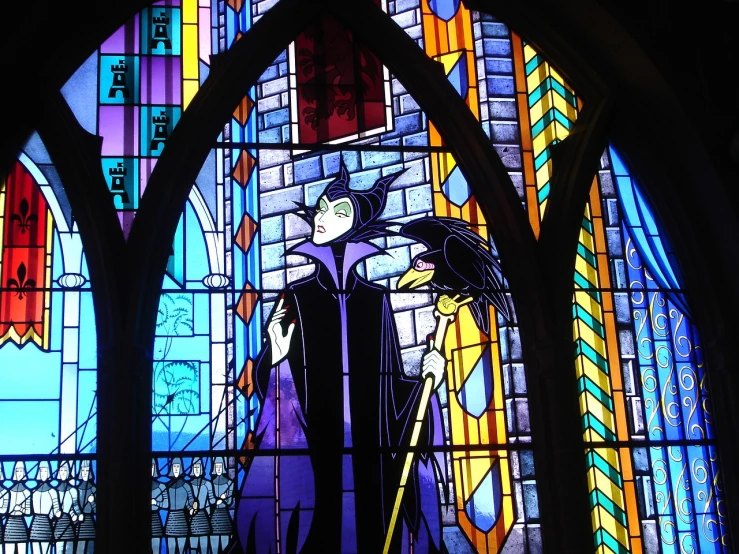 a close up of a stained glass window in a building, by Brenda Chamberlain, flickr, female disney villain, in this church interior, ravens, oz