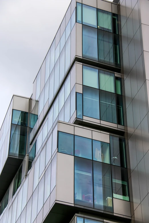 a very tall building with lots of windows, a photo, shutterstock, espoo, glass window, detailed zoom photo, office