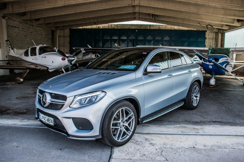 a silver mercedes suv parked in a garage, by Alexander Fedosav, 50mm 4k, mecca, very very happy!, marble!! (eos 5ds r