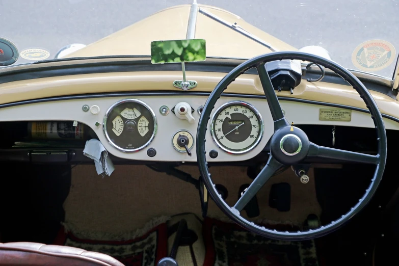 a close up of a steering wheel and dashboard of a car, by David Simpson, modernism, square, antique style, buggy, summertime