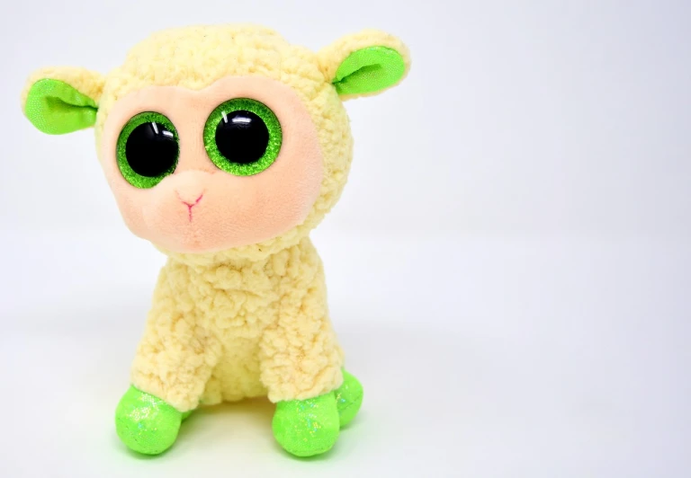 a close up of a stuffed animal with green eyes, a picture, hurufiyya, electric sheep, high quality product photo, snapchat photo, bright shining eyes