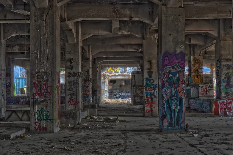 a room filled with lots of graffiti covered walls, flickr, concrete pillars, hdr!, under bridge, toronto