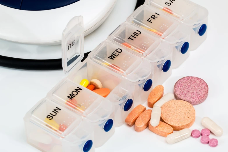 a bunch of pills sitting on top of a table, a stock photo, by Kurt Roesch, shutterstock, antipodeans, medical machinery, miniature product photo, packshot, medical labels