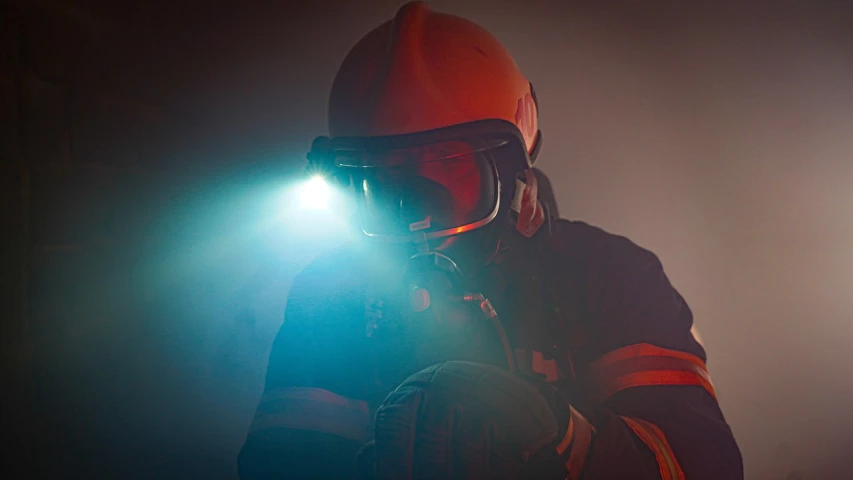 a fireman wearing a helmet and holding a flashlight, shutterstock, figuration libre, worksafe. instagram photo, light dust, medical lighting, footage