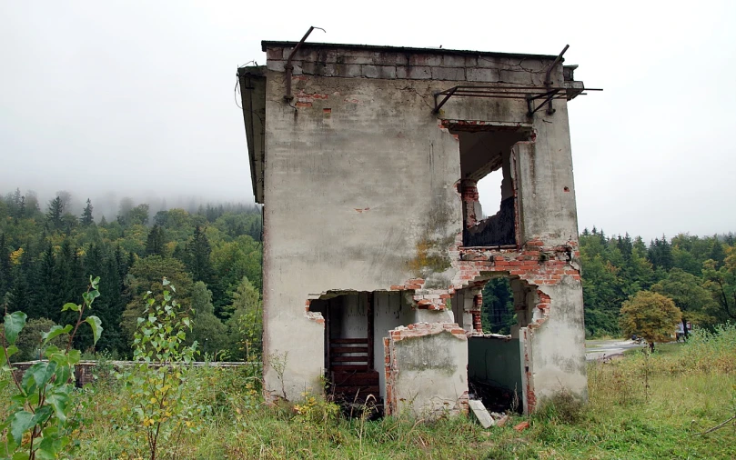 an old building sitting in the middle of a field, by Henryka Beyer, flickr, smashed wall, front side view, vladimir pchelin, two stories