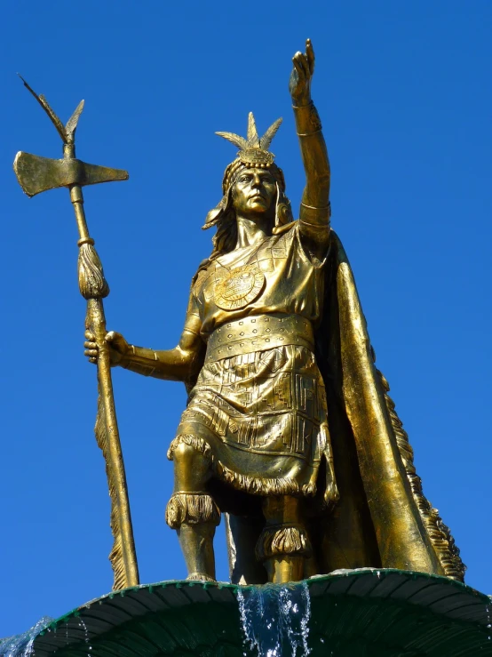 a statue of a man standing on top of a fountain, a statue, inspired by Nicomachus of Thebes, flickr, figuration libre, american indian headdress, gold armour, she is holding a sword, quechua!!