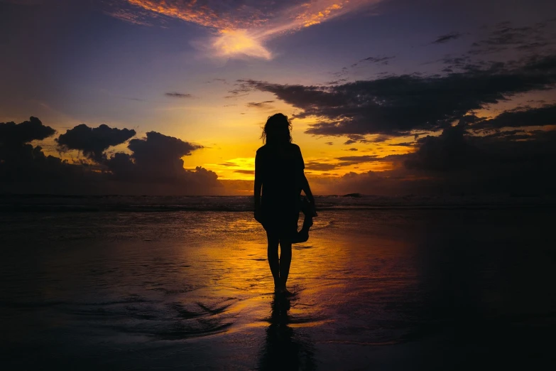 a person standing on a beach holding a surfboard, a picture, beautiful female body silhouette, sunset and big clouds behind her, walking away from the camera, bali