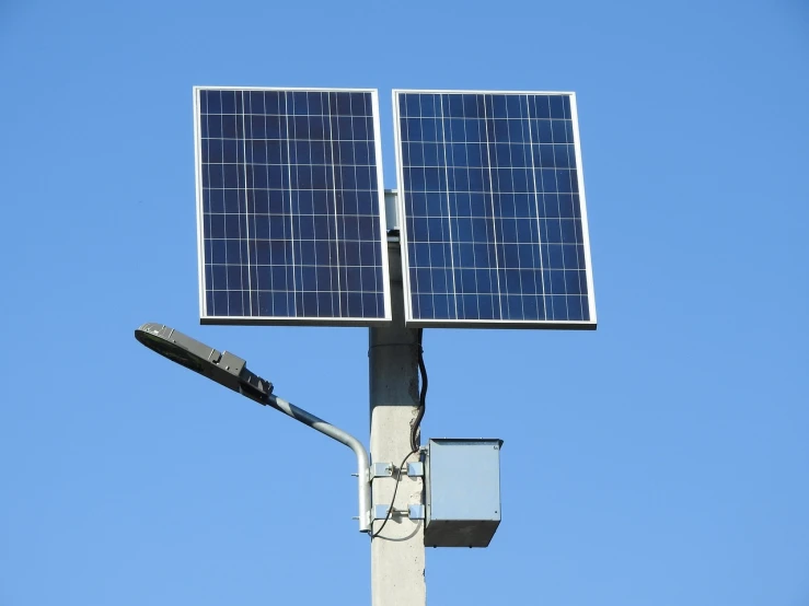 a street light with a solar panel on top of it, shutterstock, modern very sharp photo