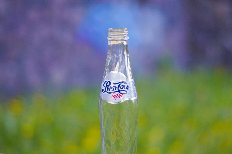 a bottle of soda sitting on top of a table, a picture, by Petr Brandl, pexels, photorealism, persian, close-up product photo, petros, prototype