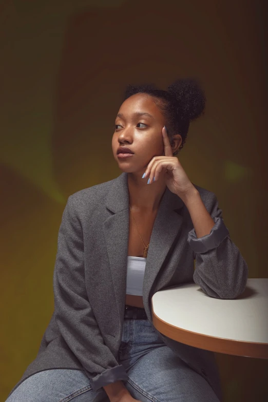 a woman sitting at a table talking on a cell phone, a portrait, by Lily Delissa Joseph, shot at night with studio lights, portrait willow smith, serious business, on a yellow canva