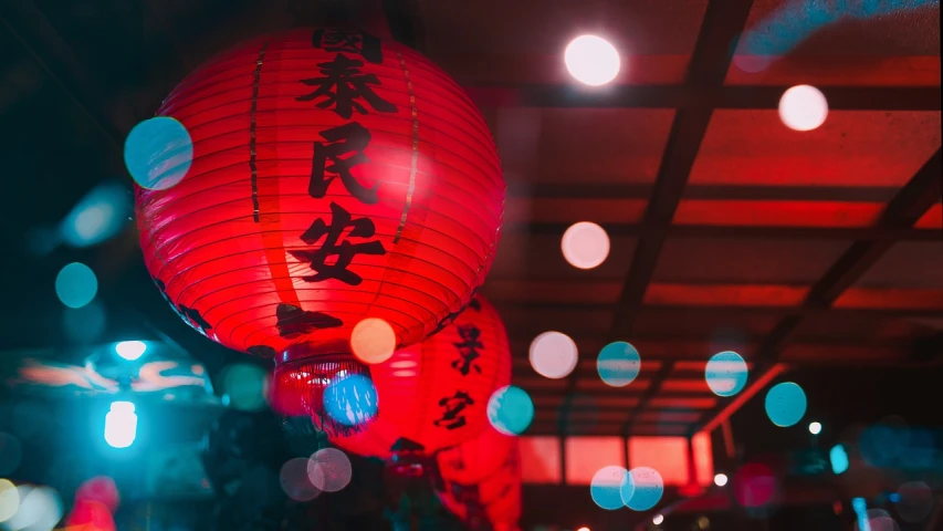 a couple of red lanterns hanging from the ceiling, a picture, by Emma Andijewska, shutterstock, visual art, chinese text, diffused lights, 🦩🪐🐞👩🏻🦳, 50mm photo