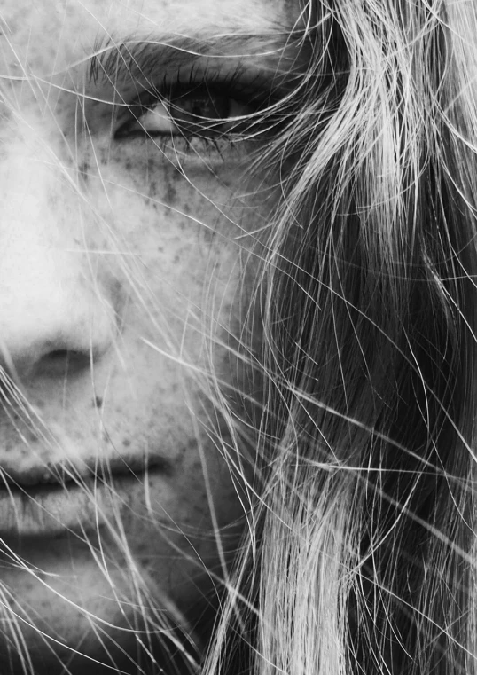 a close up of a person with long hair, a black and white photo, by Christen Dalsgaard, pexels, realism, freckle, a girl with blonde hair, hyperdetailed!, scratched photo