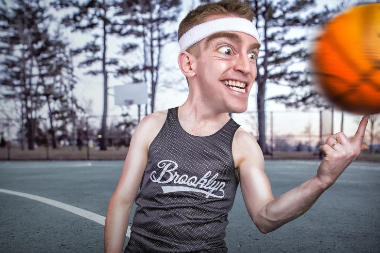 a man standing on top of a basketball court holding a basketball, a portrait, by Jason Felix, dribble contest winner, photorealism, weird silly thing with big eyes, ricky berwick, wearing a tank top and shorts, face-on head shot