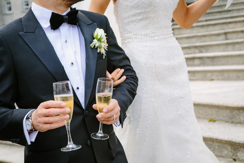 a man in a tuxedo and a woman in a wedding dress, by John Clayton Adams, pexels, champagne, afp, detail, 💣 💥