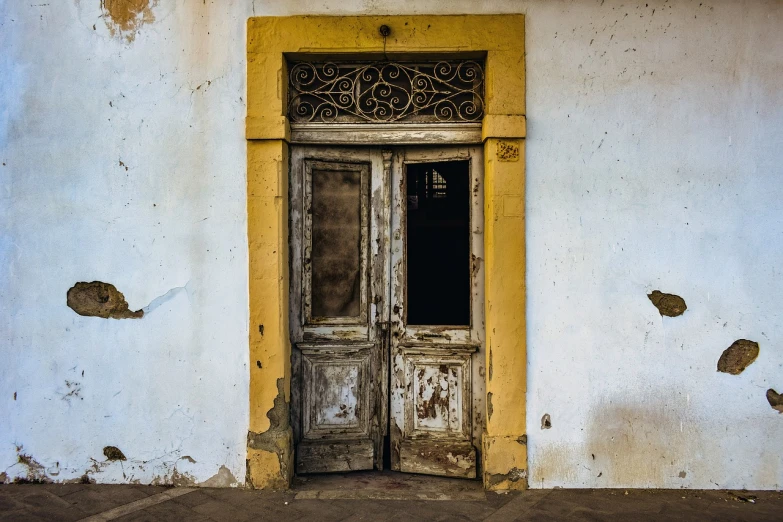 a door that is on the side of a building, pexels, brazil, abandoned town, ornately detailed, post processed