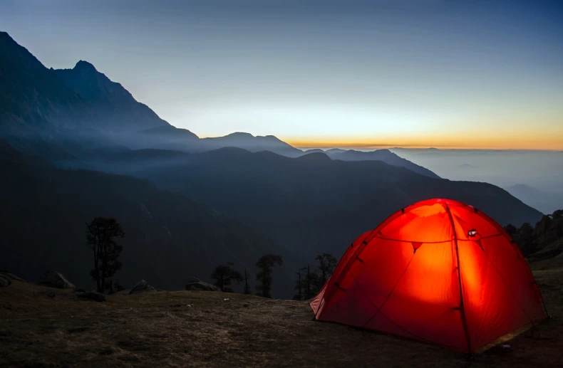 a red tent sitting on top of a mountain, shutterstock, early morning lighting, uttarakhand, summer camp, at dusk!