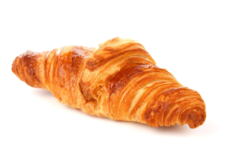 a close up of a croissant on a white surface, shutterstock, figuration libre, diagonal, on a white background, fluorescent, stock photo