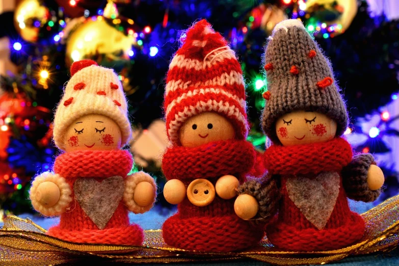 three knitted dolls sitting next to each other in front of a christmas tree, a picture, hd wallpaper, sweet smile, bells, warm