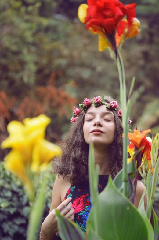 a woman standing in the middle of a field of flowers, inspired by Sophie Gengembre Anderson, romanticism, lotus floral crown girl, dslr photo of a pretty teen girl, eyes closed, with colorful flowers and plants