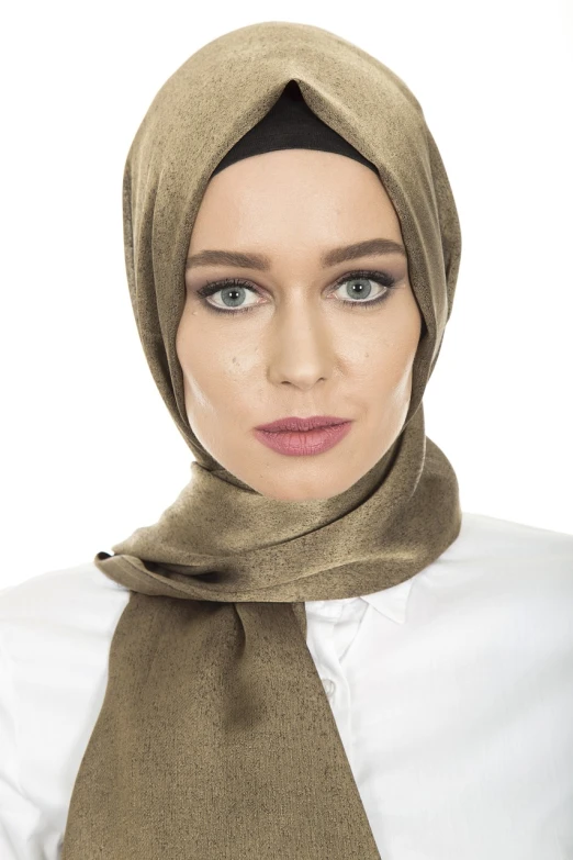 a woman in a hijab poses for a picture, a colorized photo, shutterstock, hurufiyya, made in bronze, close-up product photo, - h 7 0 4, sandy beige