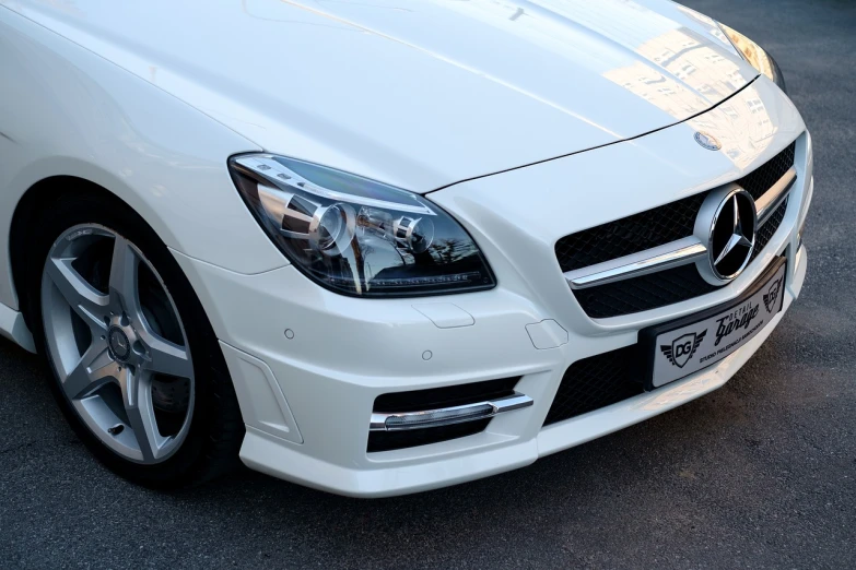 a white mercedes benz benz benz benz benz benz benz benz benz benz benz benz benz benz benz, by Simon Gaon, tumblr, photorealism, bottom body close up, trimmed with a white stripe, brightly-lit, gloss