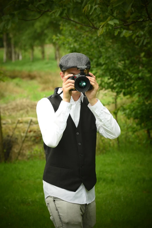 a man taking a picture with a camera, inspired by Bert Hardy, art photography, waistcoat, wearing 1890s era clothes, modern high sharpness photo