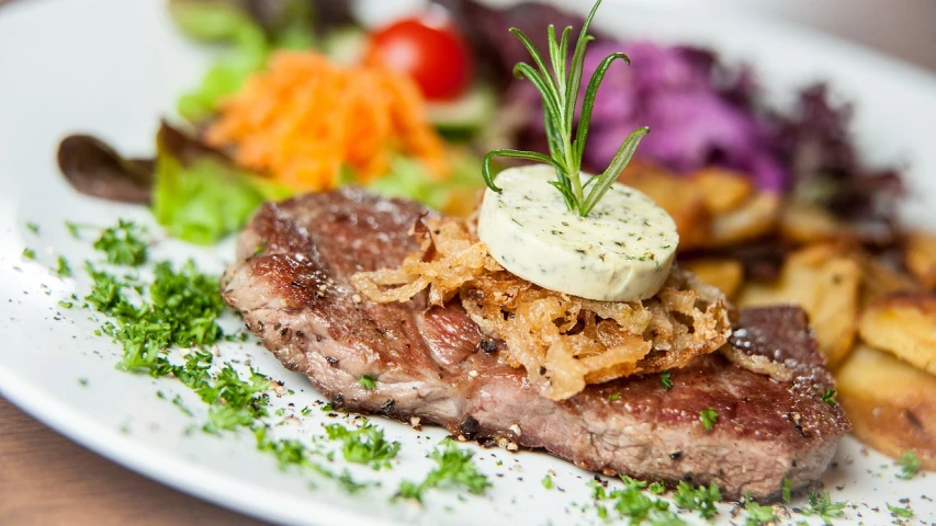 a close up of a plate of food on a table, a picture, by Aleksander Gierymski, shutterstock, steak, restaurant menu photo, detailed picture, bovine