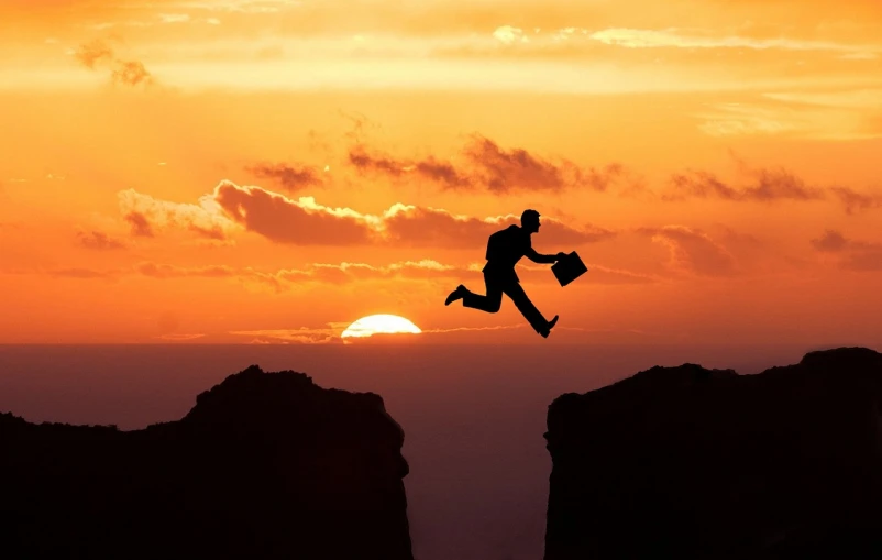 a man flying through the air while riding a skateboard, a picture, happening, ((sunset)), falling off a cliff, working hard, bag