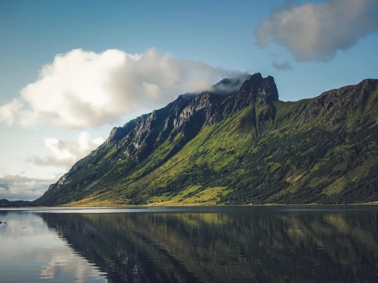 a body of water with a mountain in the background, a picture, by Caspar Wolf, pexels contest winner, nordic crown, 4 k vertical wallpaper, summer morning, cut into the side of a mountain